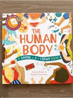 Usborne The Human Body. Shine a light book. Gently Used.